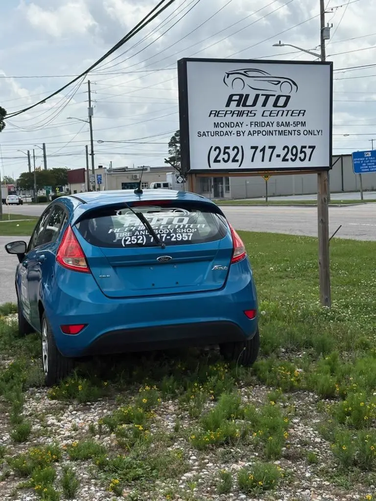 Javier Ruiz, owner and master mechanic, working in his Greenville auto shop